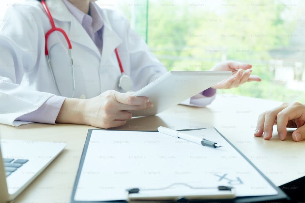 Doctor chacking patient. Doctor examines a patient with a stethoscope. Health, Hospital and Medical concept.