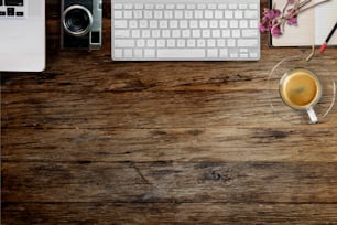 Rustic wood designer desk table with photographer stuff. Top view with copy space, flat lay or hero header concept.