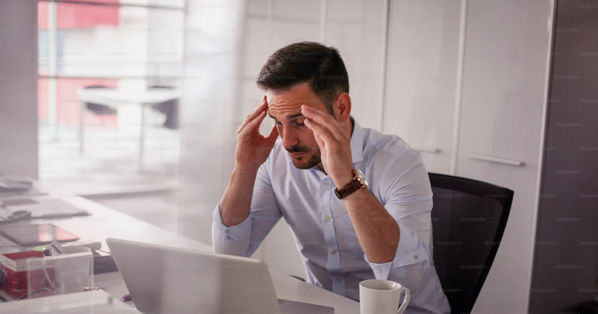 Business man having problem in the work. Business man sitting in office ...