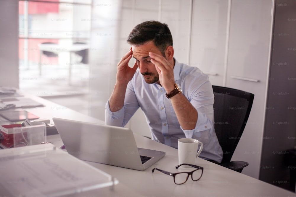 Business man having problem in the work. Business man sitting in office.