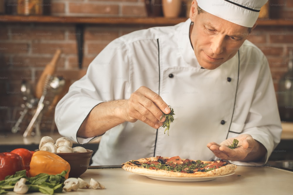 Bakery chef cooking bake in the kitchen professional decorating