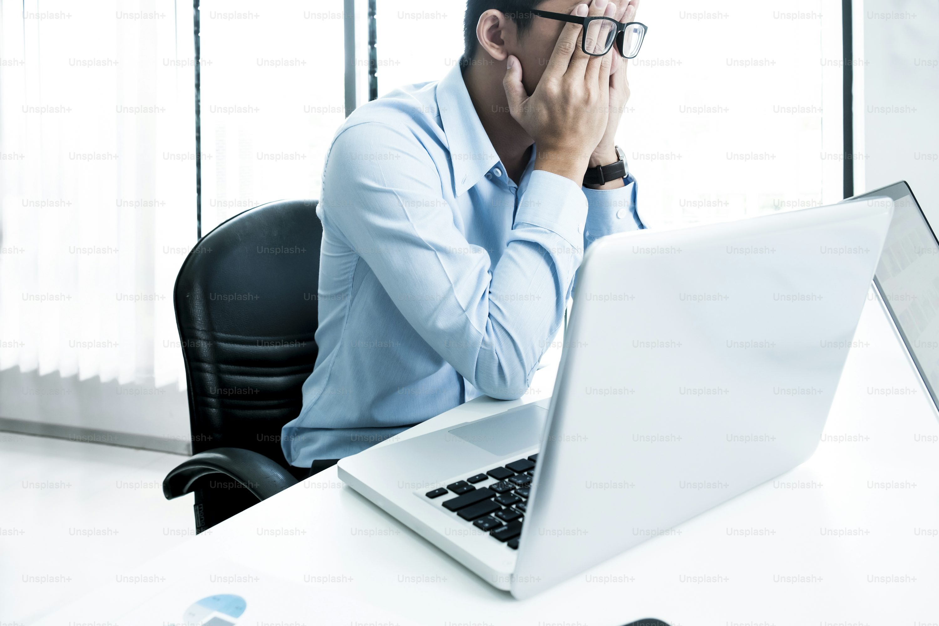 Serious businessman using laptop in office. Business analysis planing and solution objective strategy concept