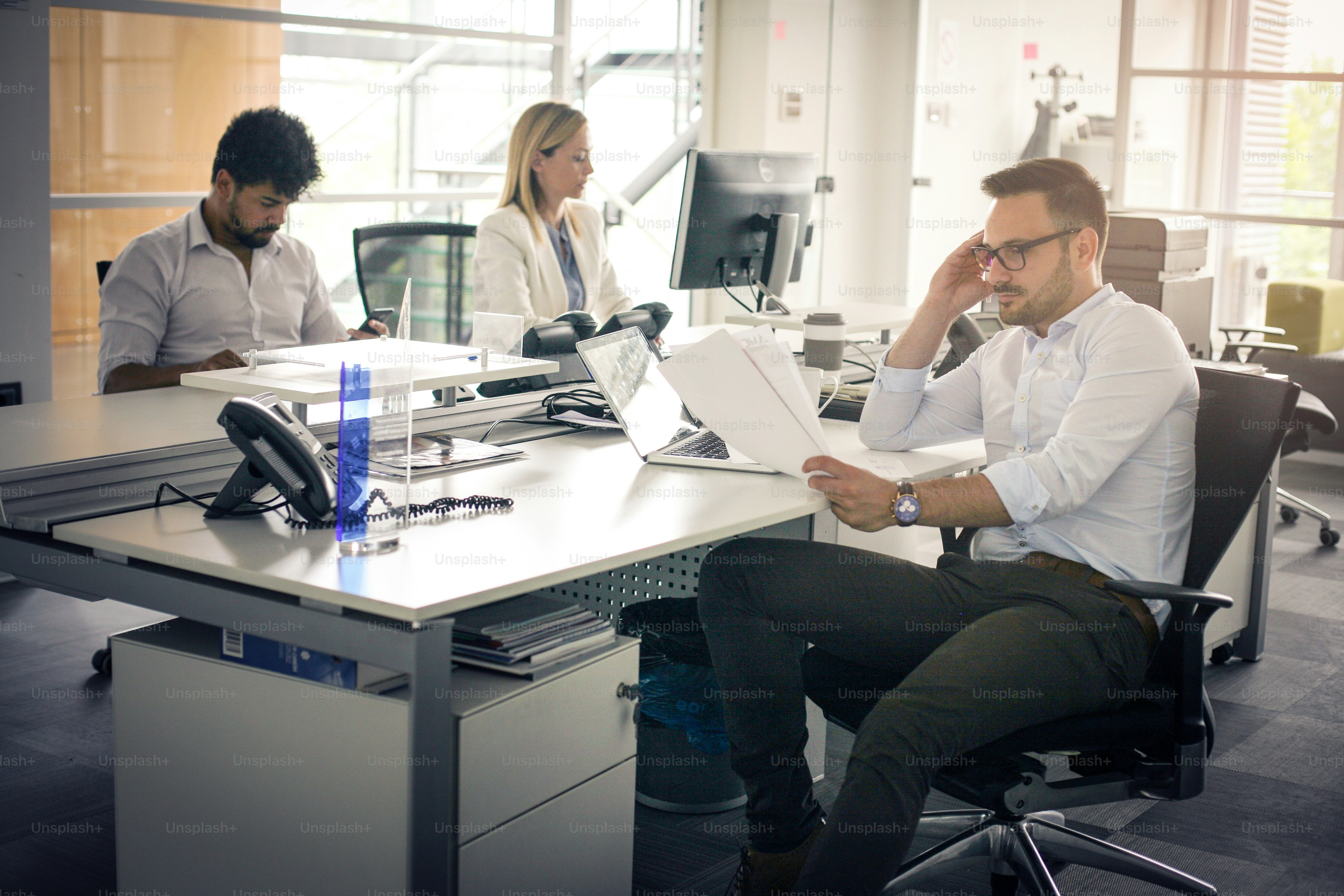 Business people working Business people together in office.