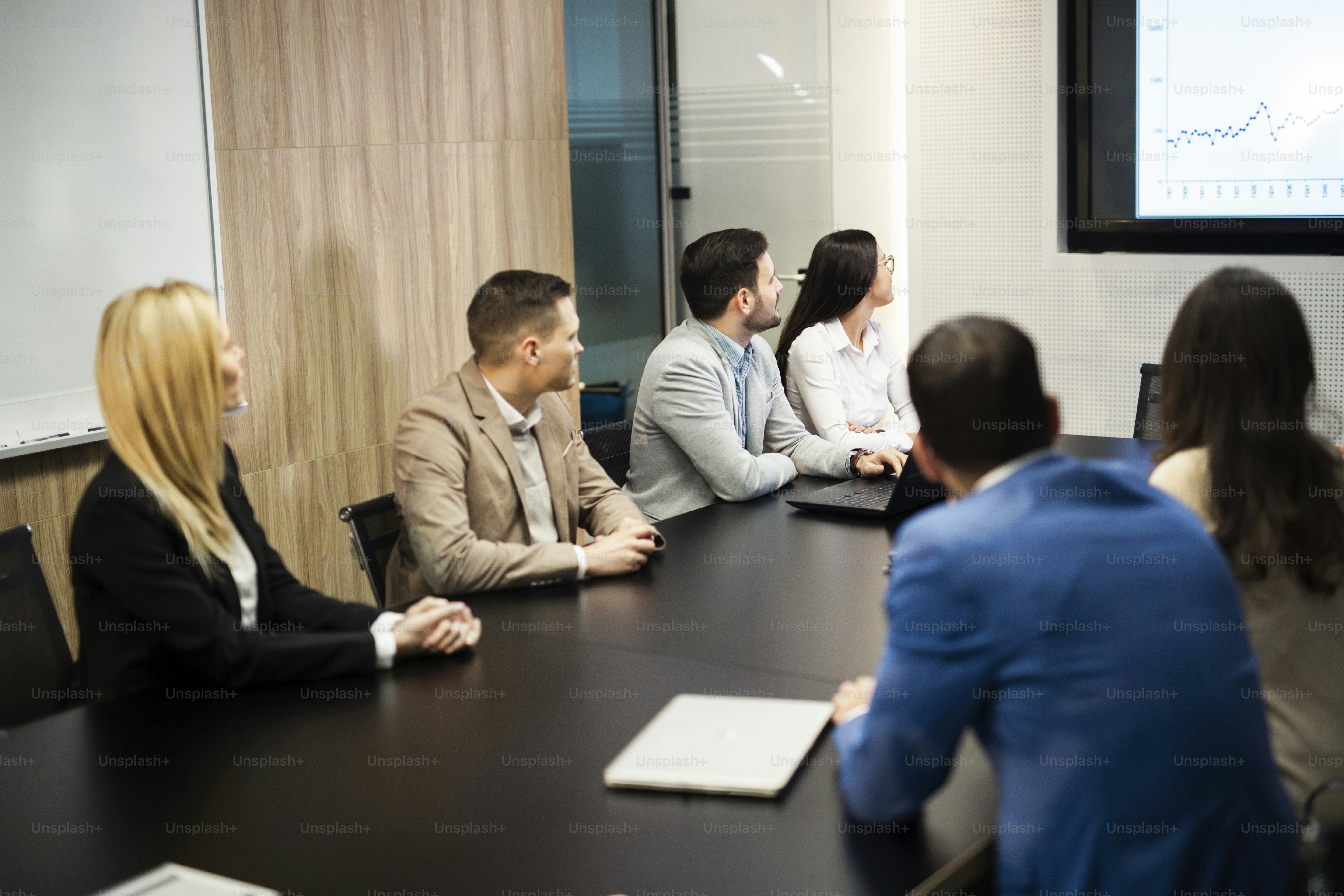 Perspective young businesspeople having meeting in conference room