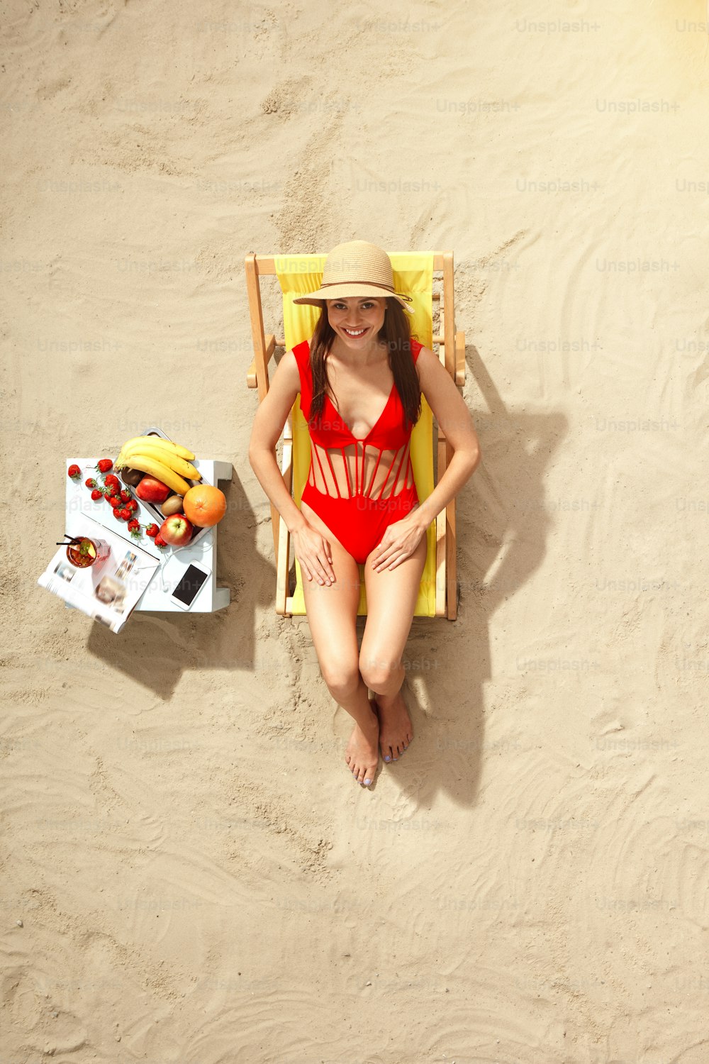 Young female traveler tourist top view sunbathing