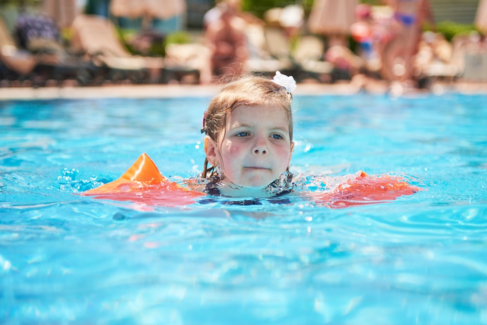 Girl swimming in the pool