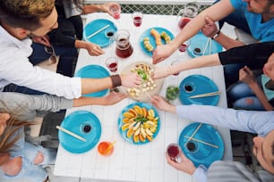 Friends birthday at a picnic. Positive emotions. The holiday table