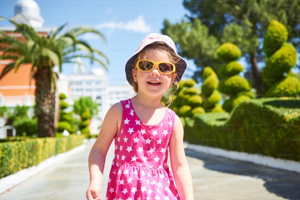 Portrait of a happy child wearing sunglasses outdoors in summer day. Amara Dolce Vita Luxury Hotel. Resort. Tekirova-Kemer. Turkey