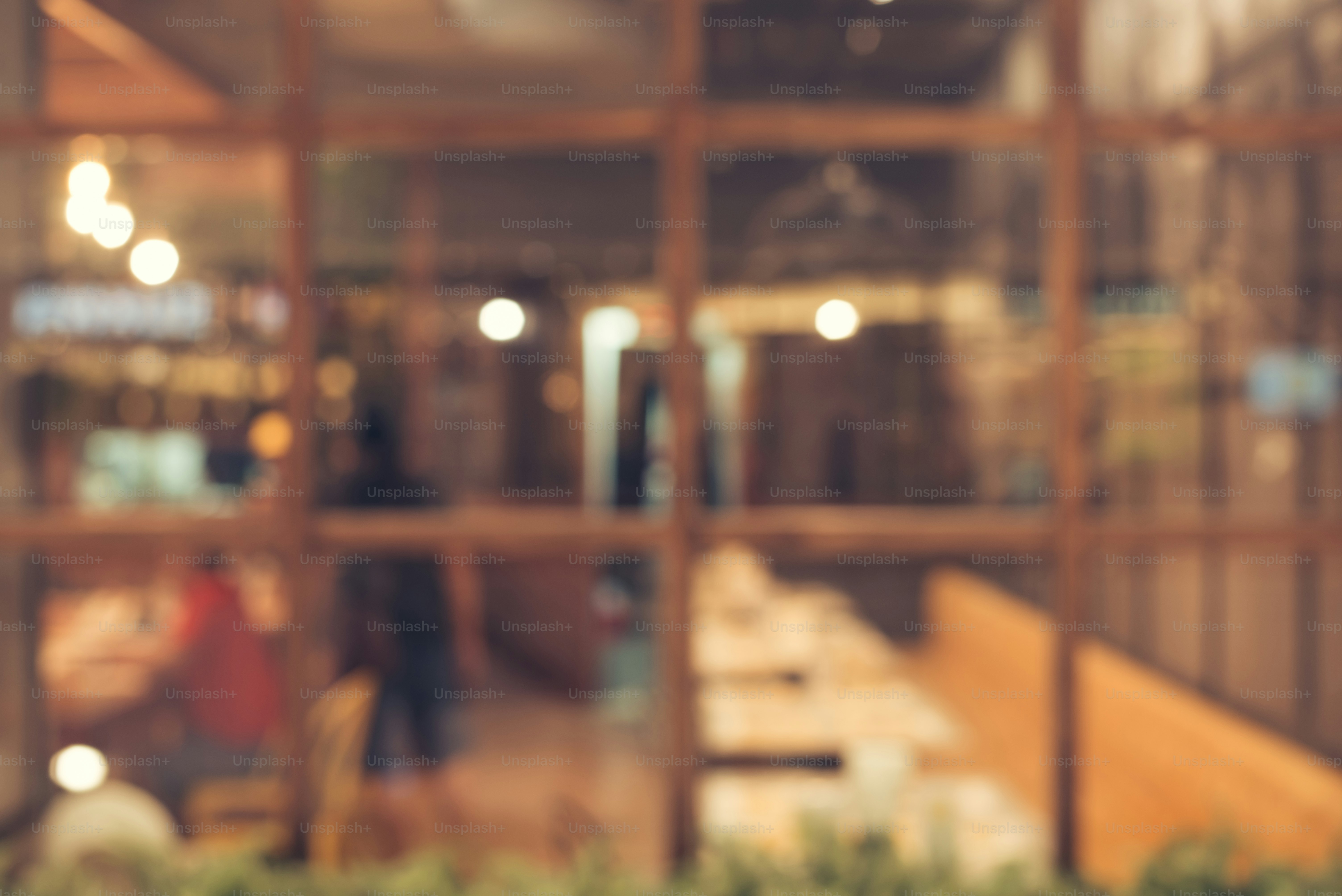 Blurred background - Vintage filter Customer in Coffee shop blur background with bokeh.