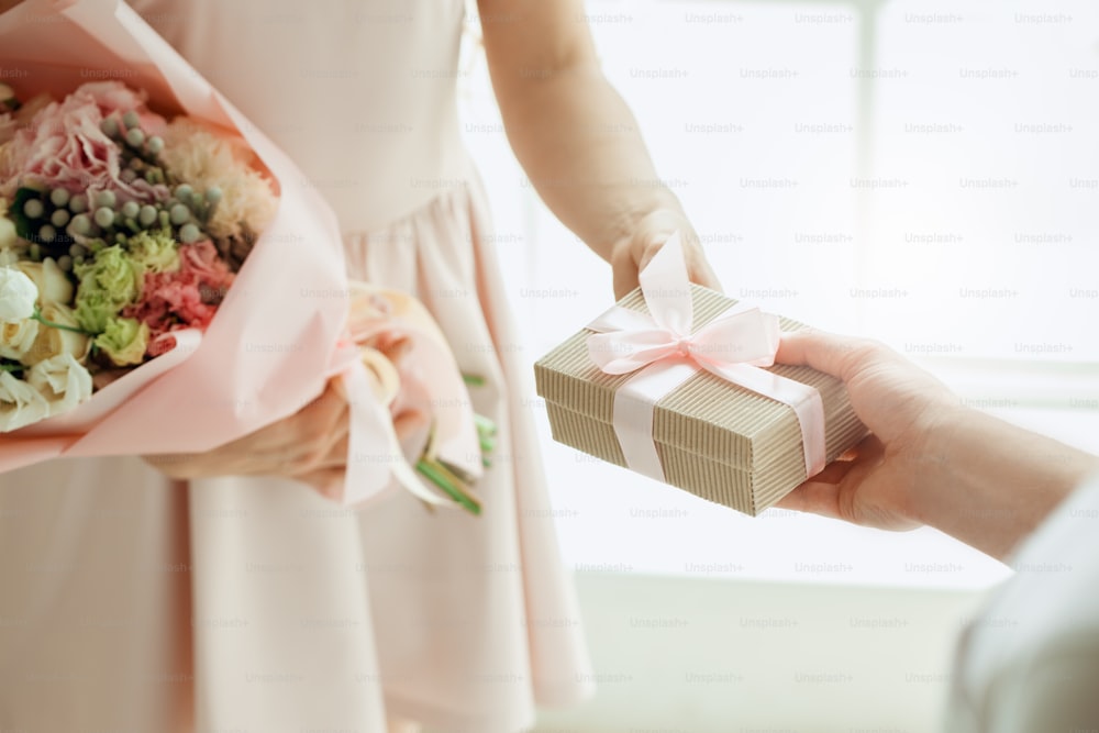 Young female with a bouquet of flowers delivery