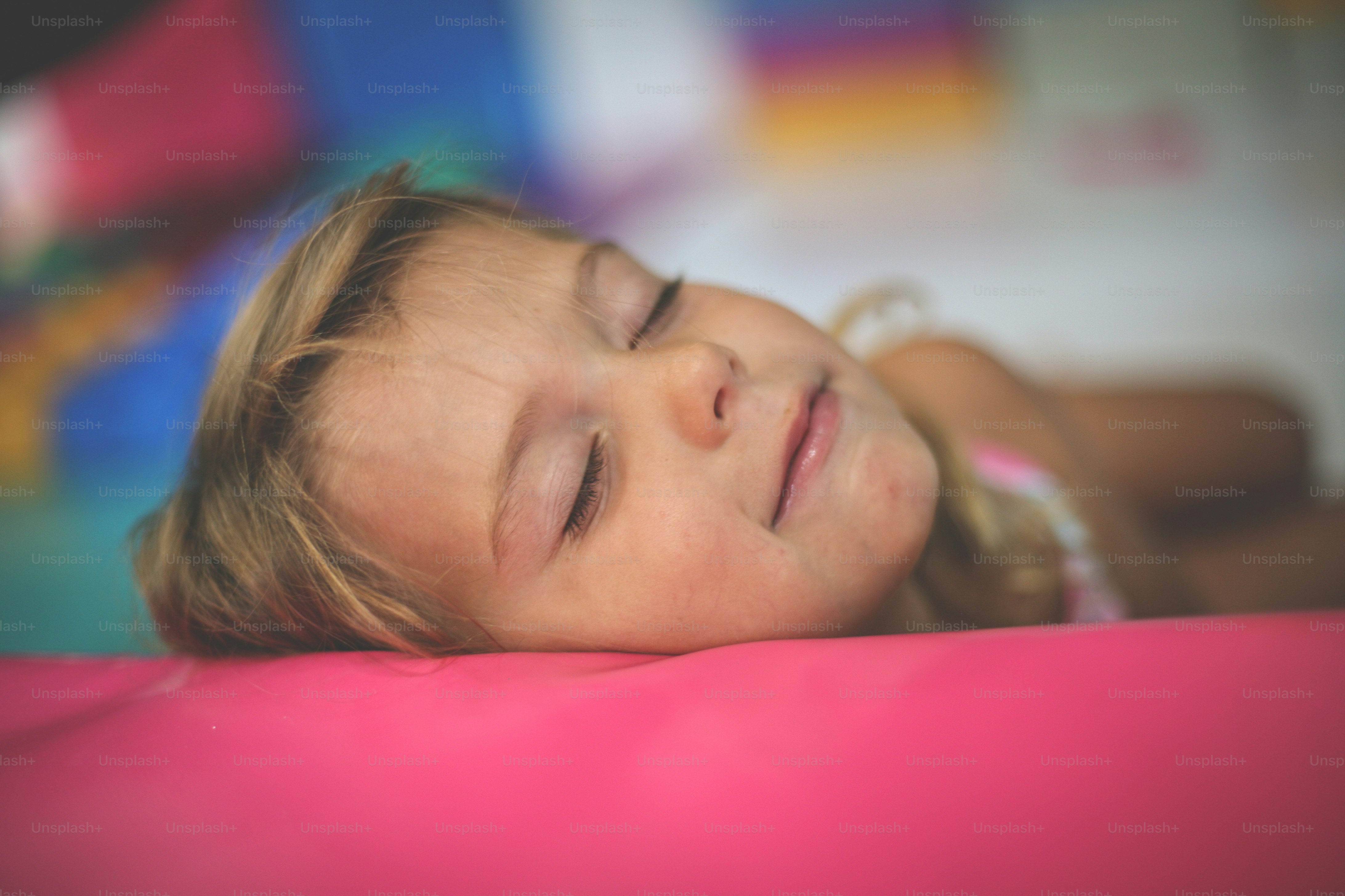 Little girl in playground. Caucasian girl dreaming in playroom.