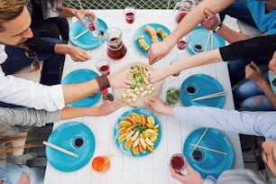 Friends birthday at a picnic. Positive emotions. The holiday table