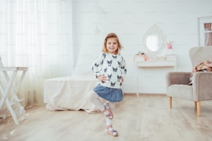 Cute little girl dreams of becoming a ballerina. Girl studying ballet