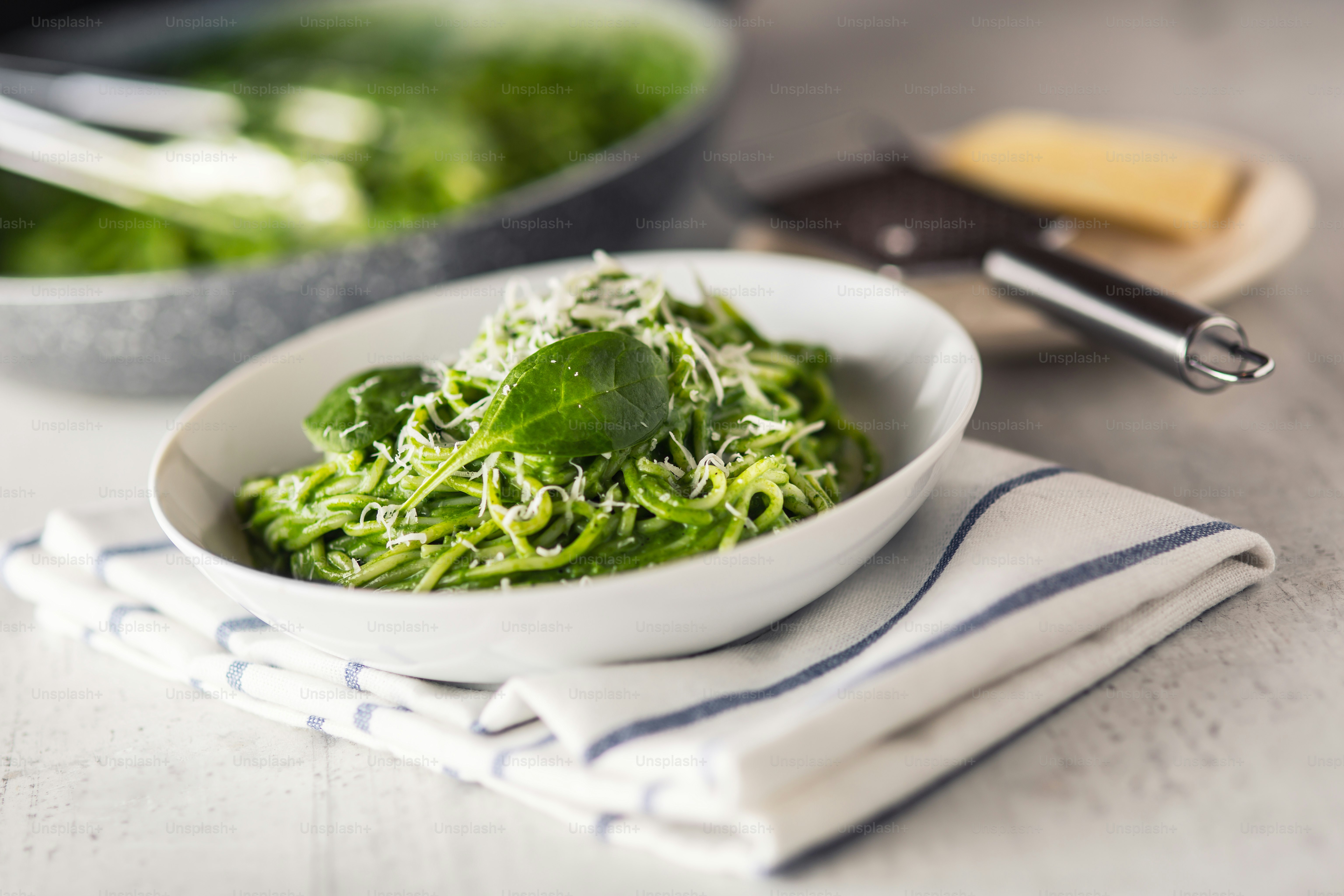 Spaghetti. Green spaghetti with spinach and parmesan. Italian and