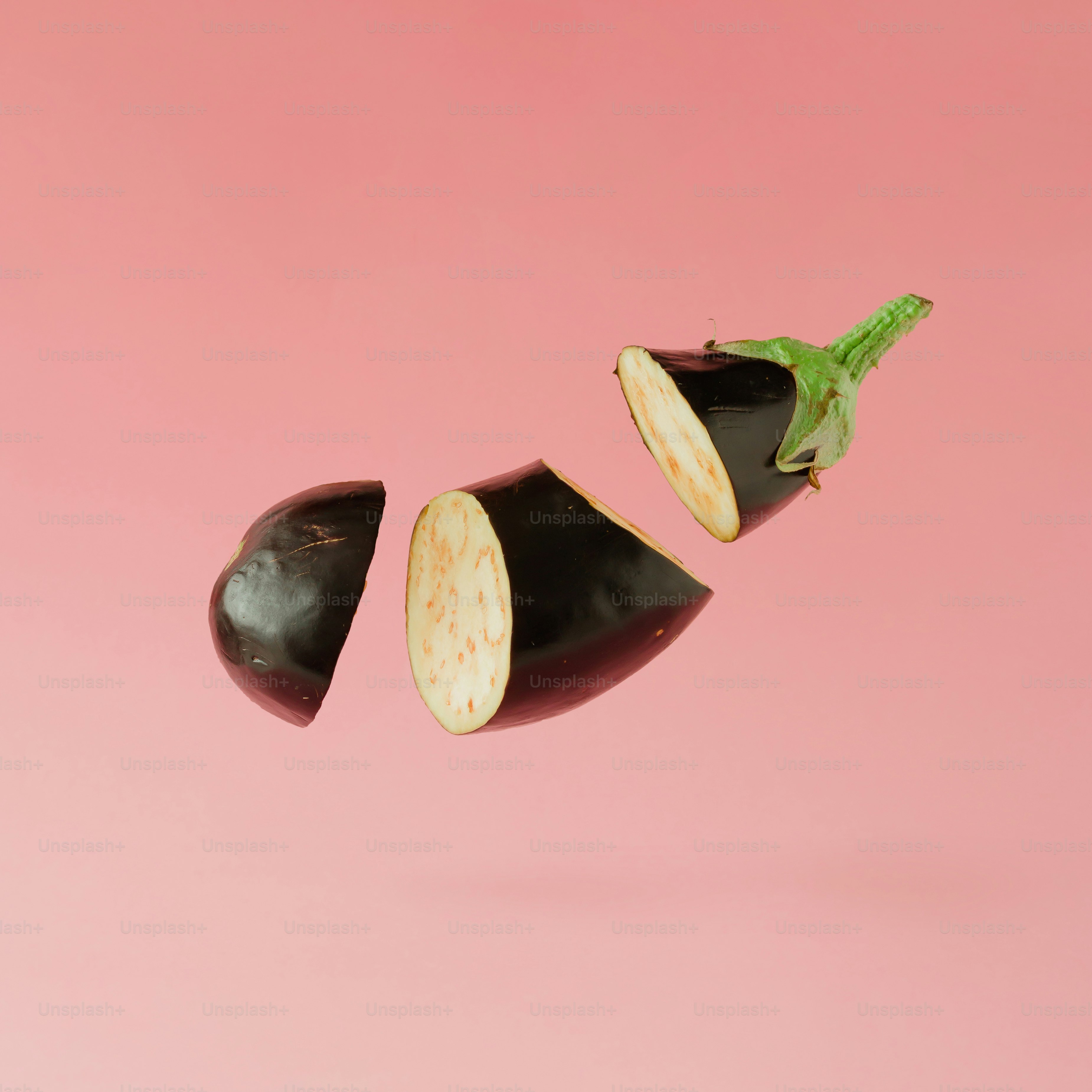 Eggplant sliced on pastel pink background. Minimal fruit concept. photo Eggplant Image on Unsplash
