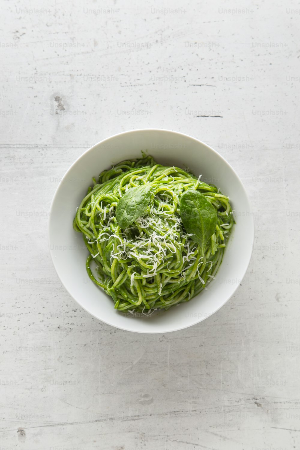 Spaghetti. Green spaghetti with spinach and parmesan. Italian and mediterranean cuisine.