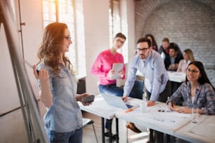 Picture of young architect doing presentation to her colleagues