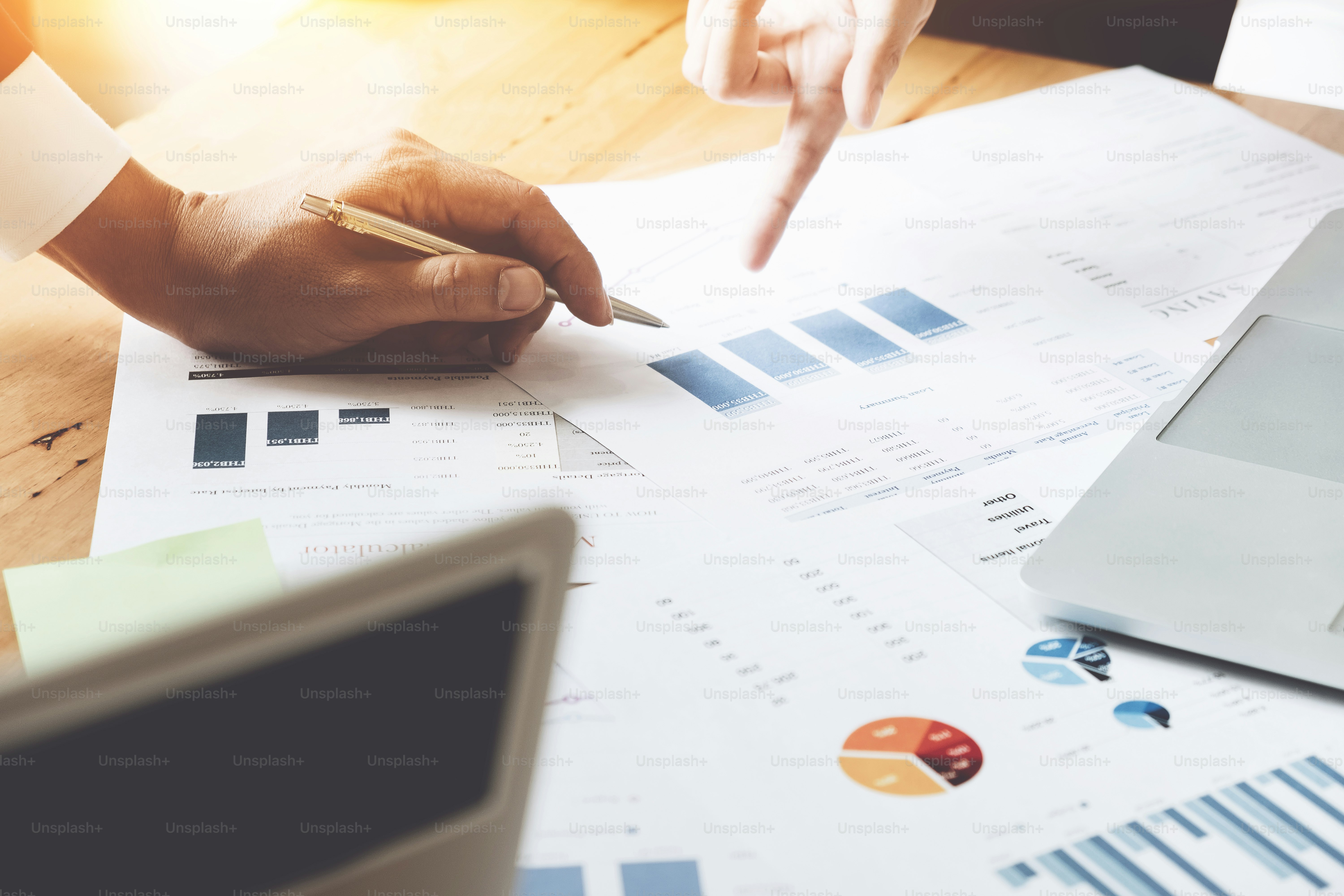 Business people discussing the charts and graphs showing the results of their successful teamwork, Business team concept
