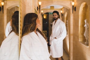 Beautiful young couple enjoying and relaxing in exclusive hotel SPA center