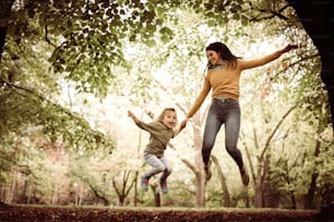 Mother and daughter have fun in the city park.