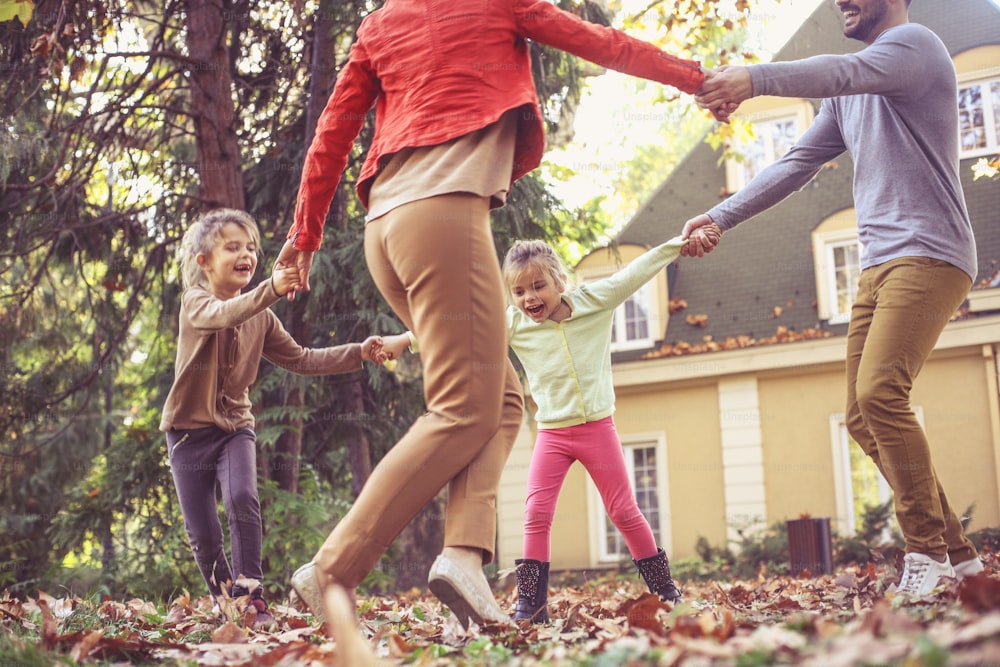 Happy family playing outside.