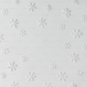 Creative winter snowflakes pattern. Minimal holidays concept. White background.