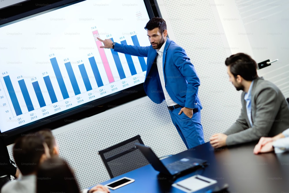 Picture of businesspeople attending to seminar in conference room