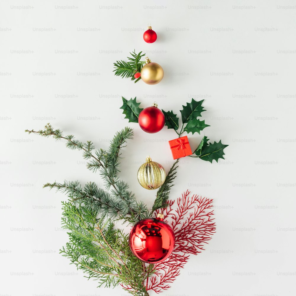 Creative layout made of Christmas tree pine branches and decoration. Holiday background. Flat lay.