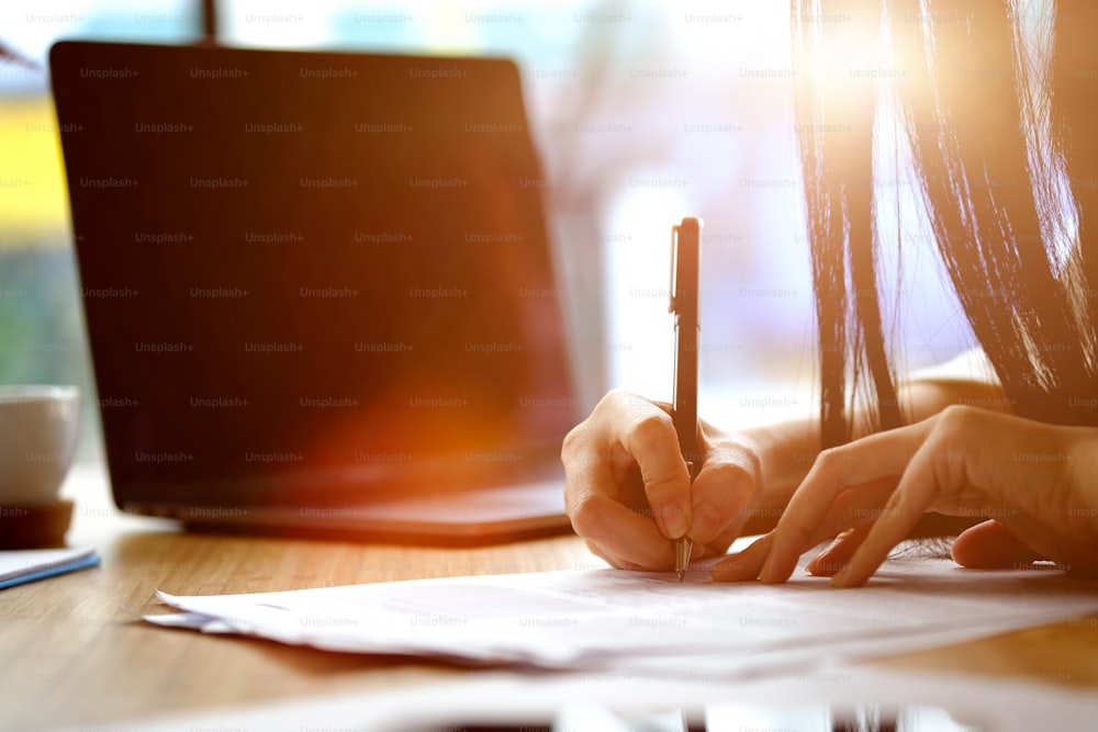 Woman working in office with documents."t