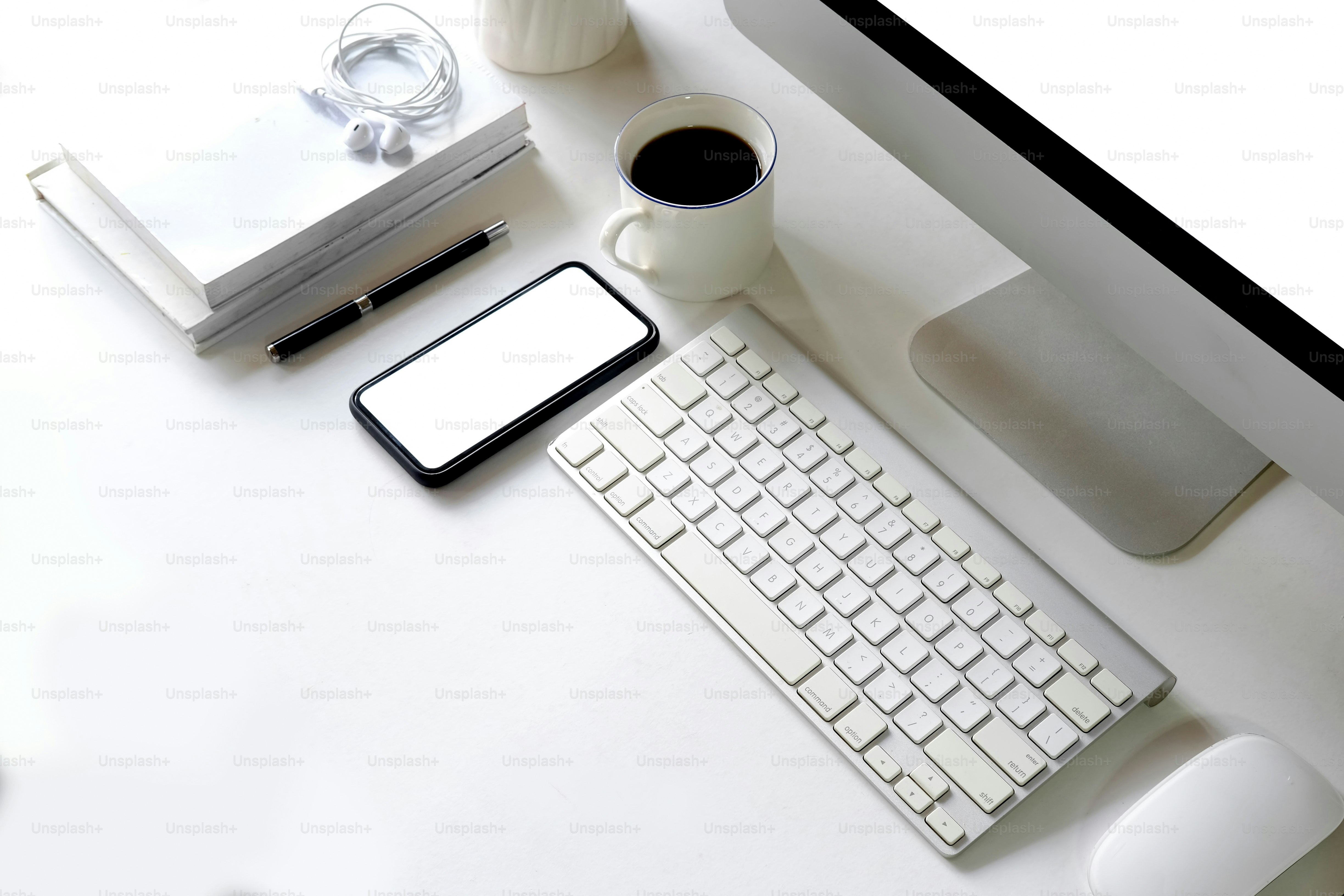 Clean workplace with desktop computer and supplies.