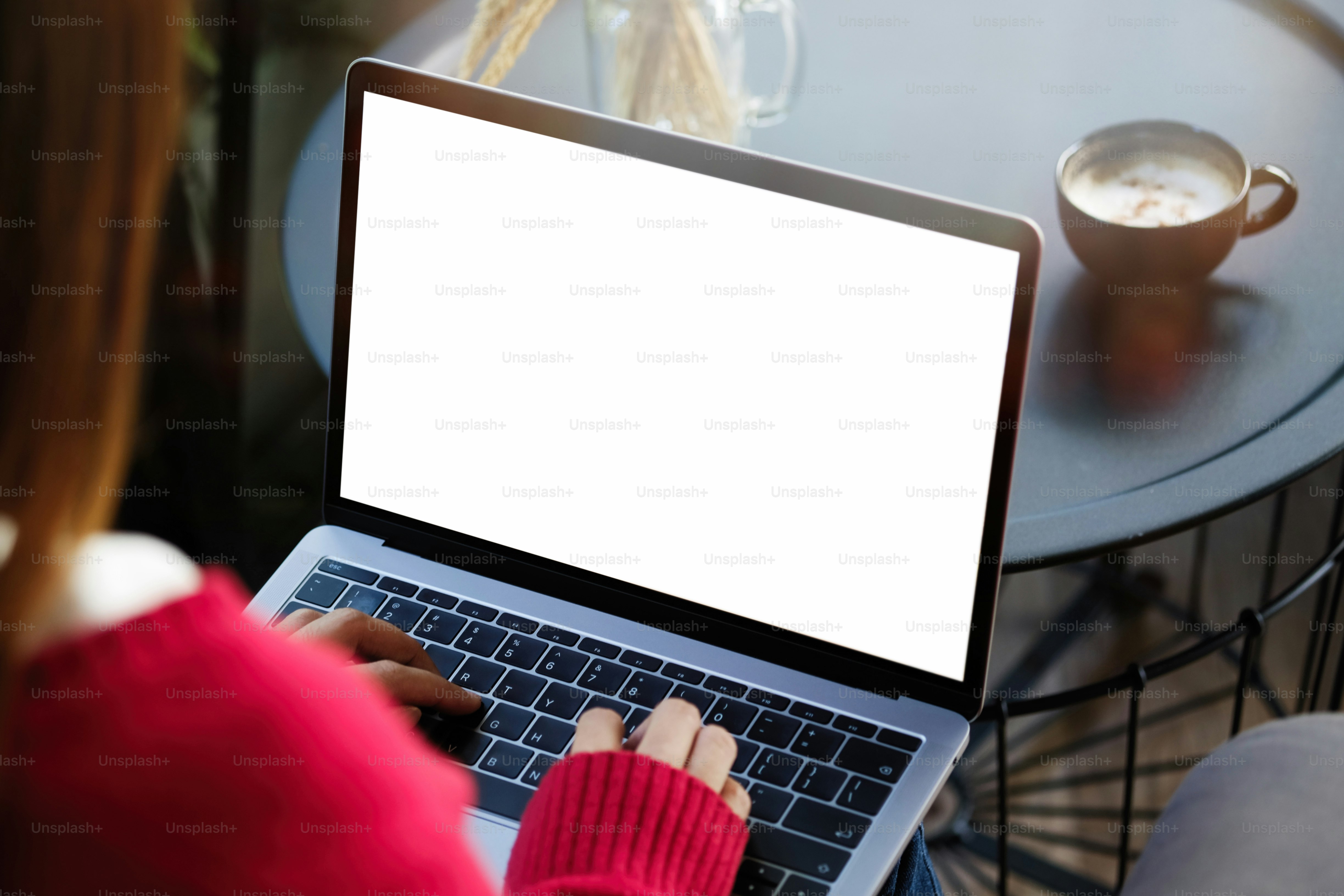 Shot of woman using and typing on laptop with blank white screen. photo ...