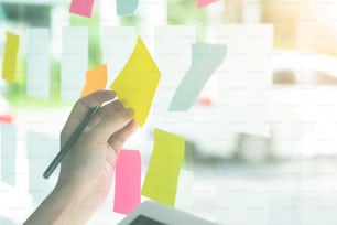 Business hands using sticky note paper with meeting.