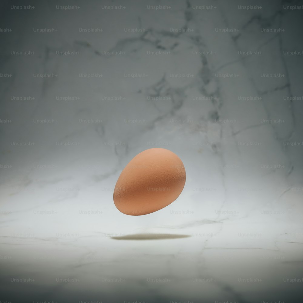 Easter egg on marble background. Minimal Easter holiday concept.