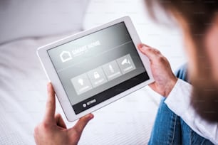 A tablet with smart home control system.A tablet with smart home control system.