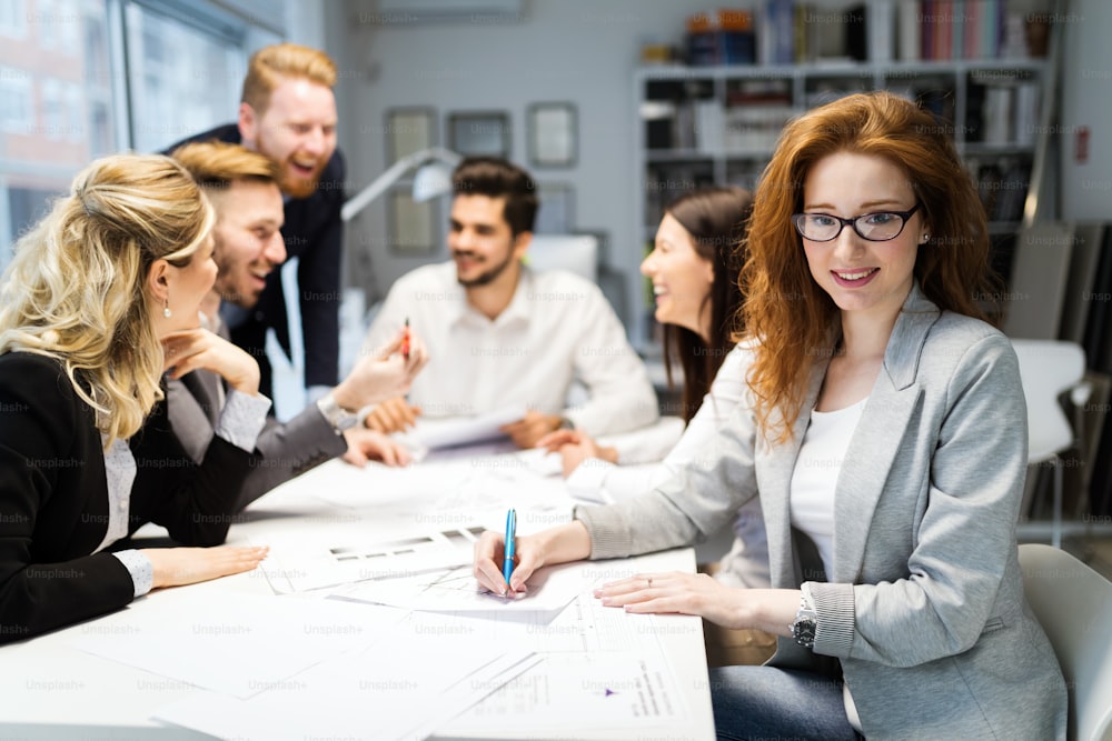 Group of young businesspeople working together on project