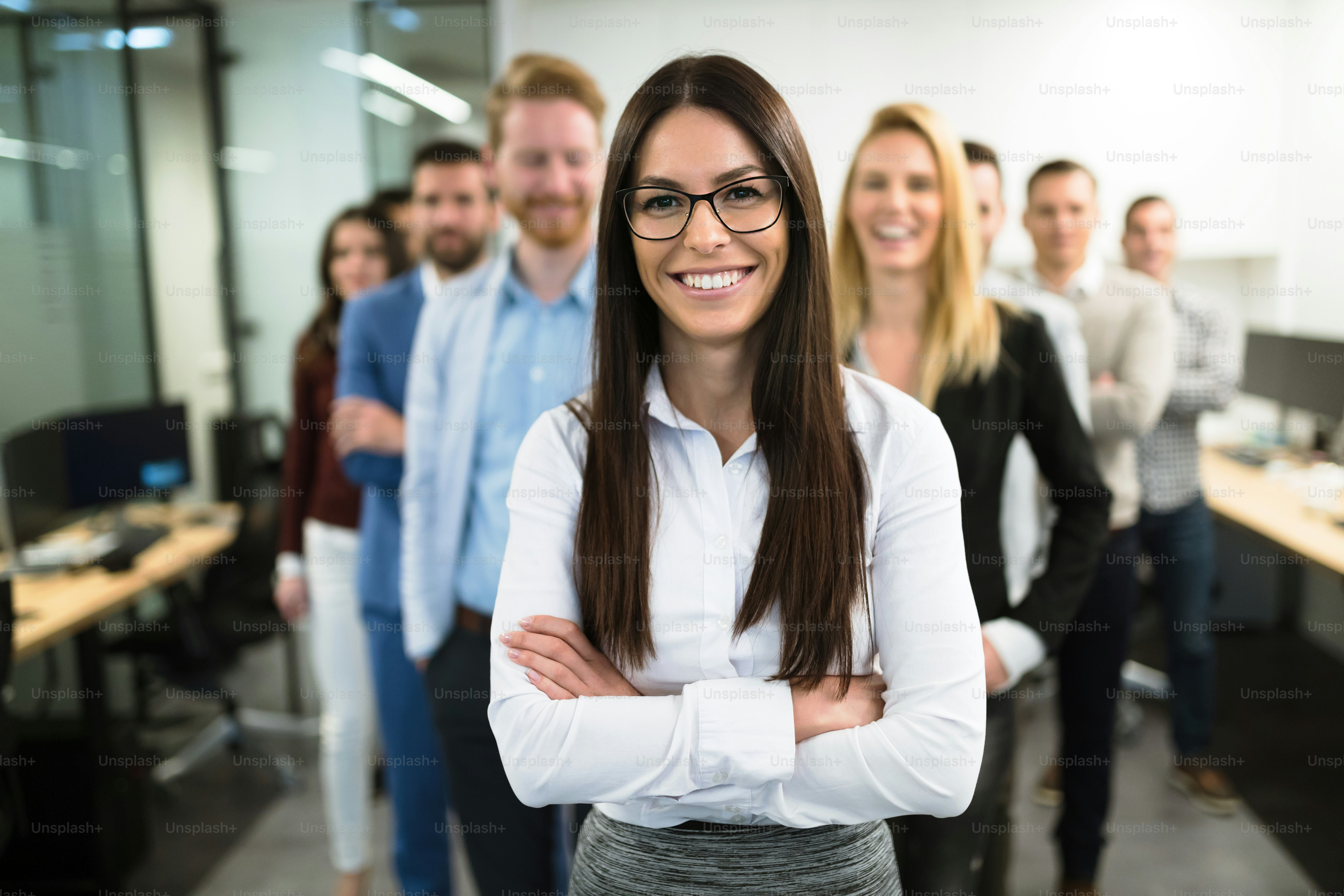 Portrait of successful business team posing in office