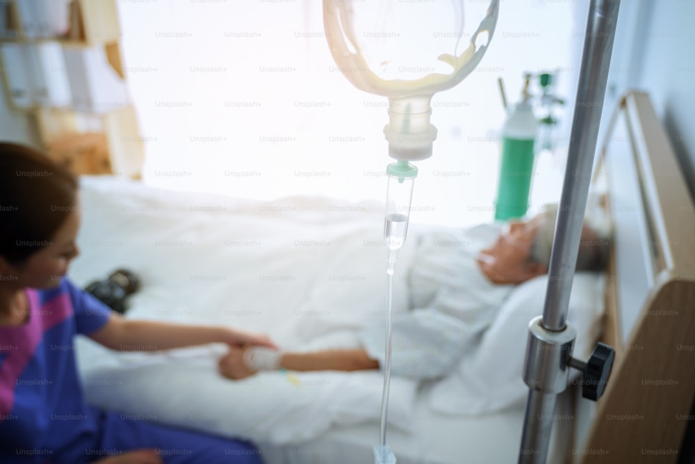 Abstract Medical Drip in the hospital room of patients in the bed blur background, Intensive therapy concept