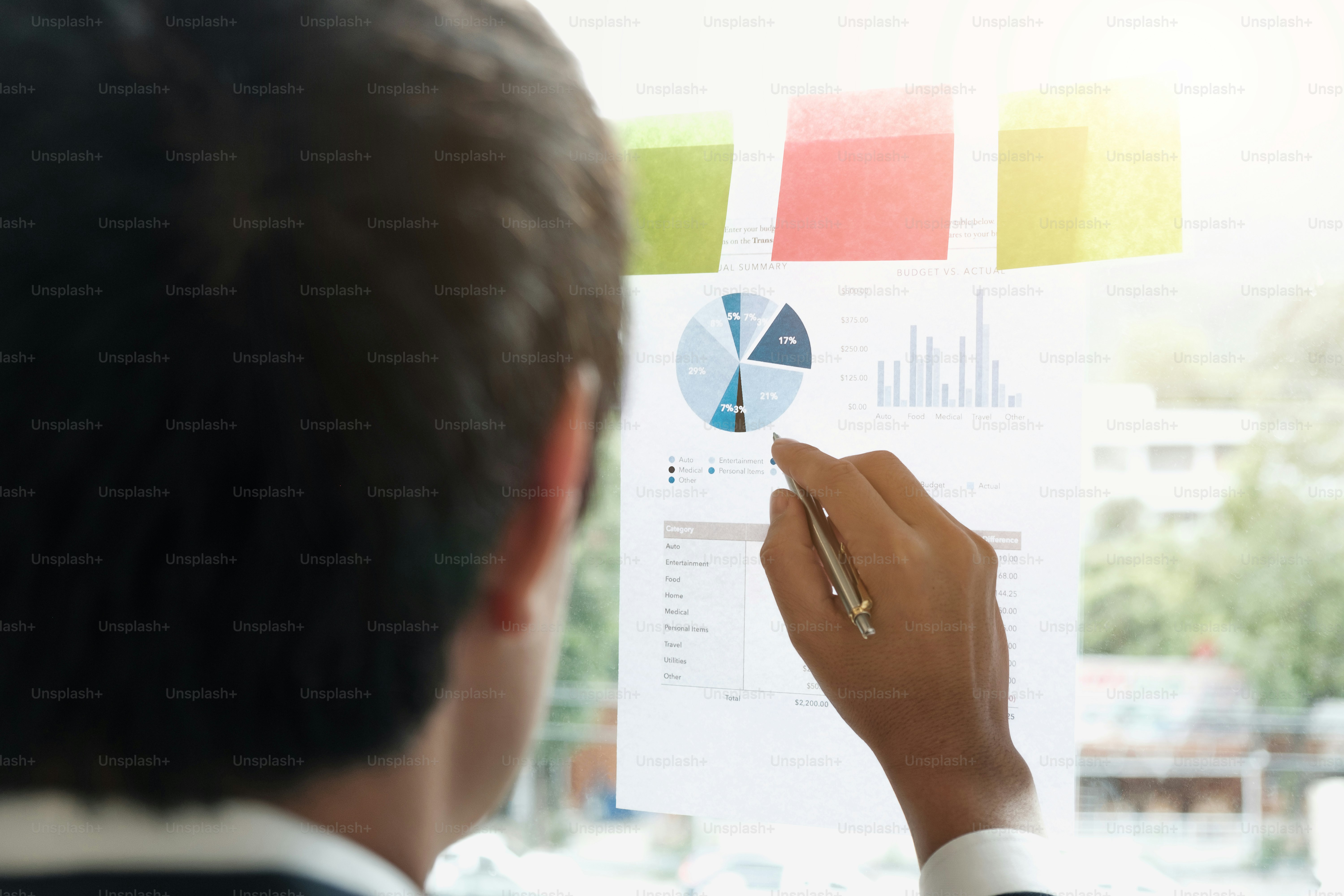 businesspeople discussing and planning concept. Front of glass wall marker and stickers. Startup office.