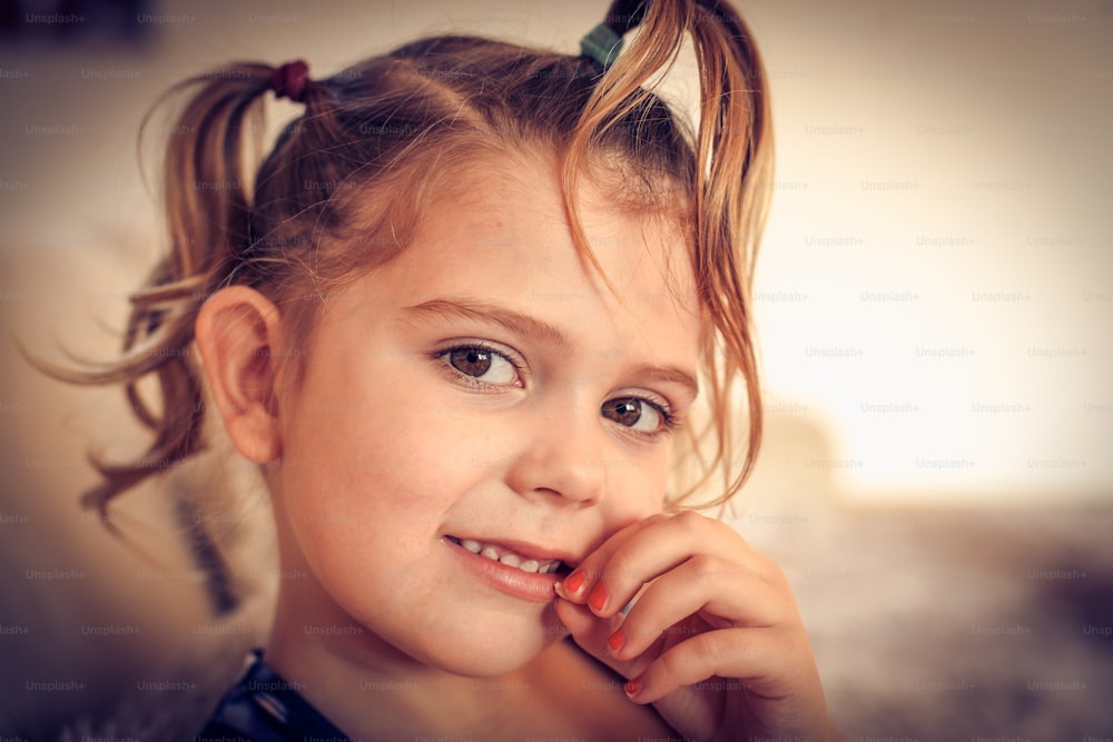 Portrait of little girl with missing teeth.