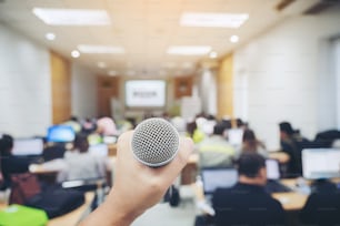 Handle microphone in meeting room backgrounds, conference hall in school and college, selective focus, education or Business meeting and event concept