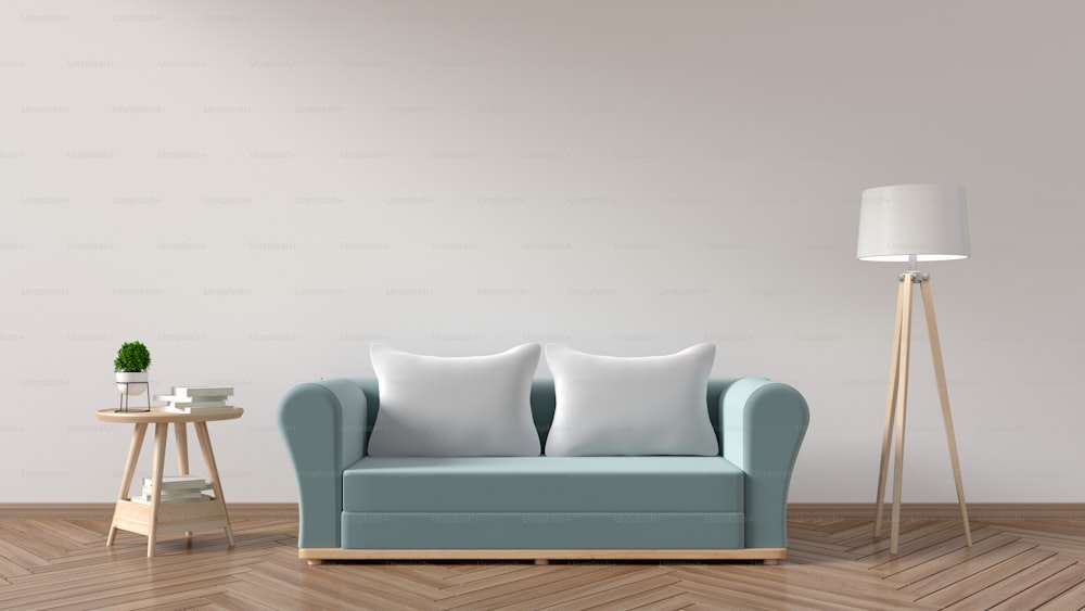 The living room has a sofa blue, pillows, lamps, books and a vase of flowers on the background wall is empty. 3D rendering.