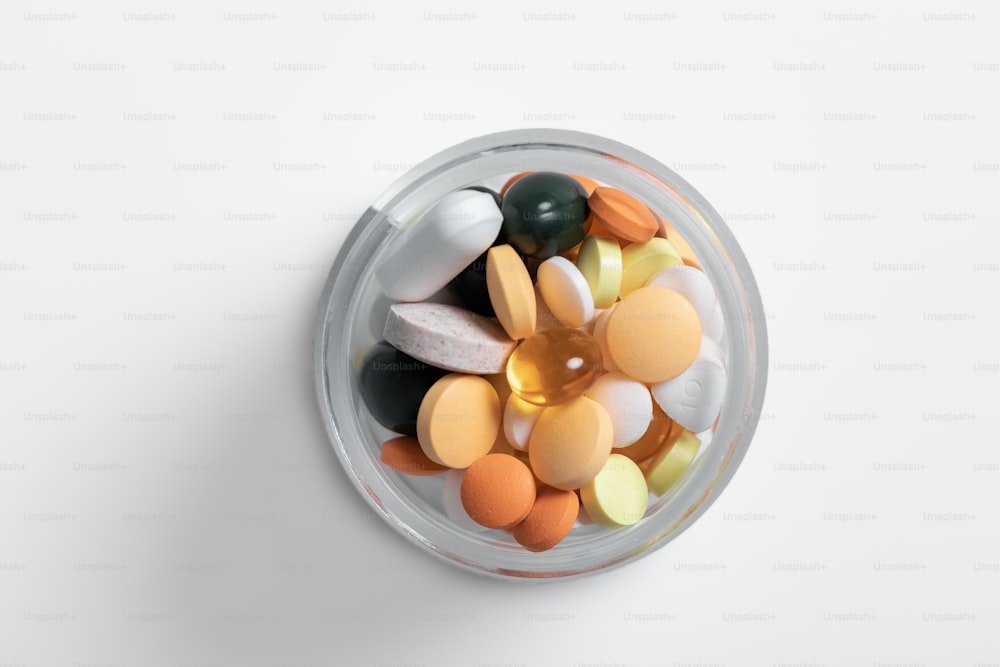different colorful pills on the white background