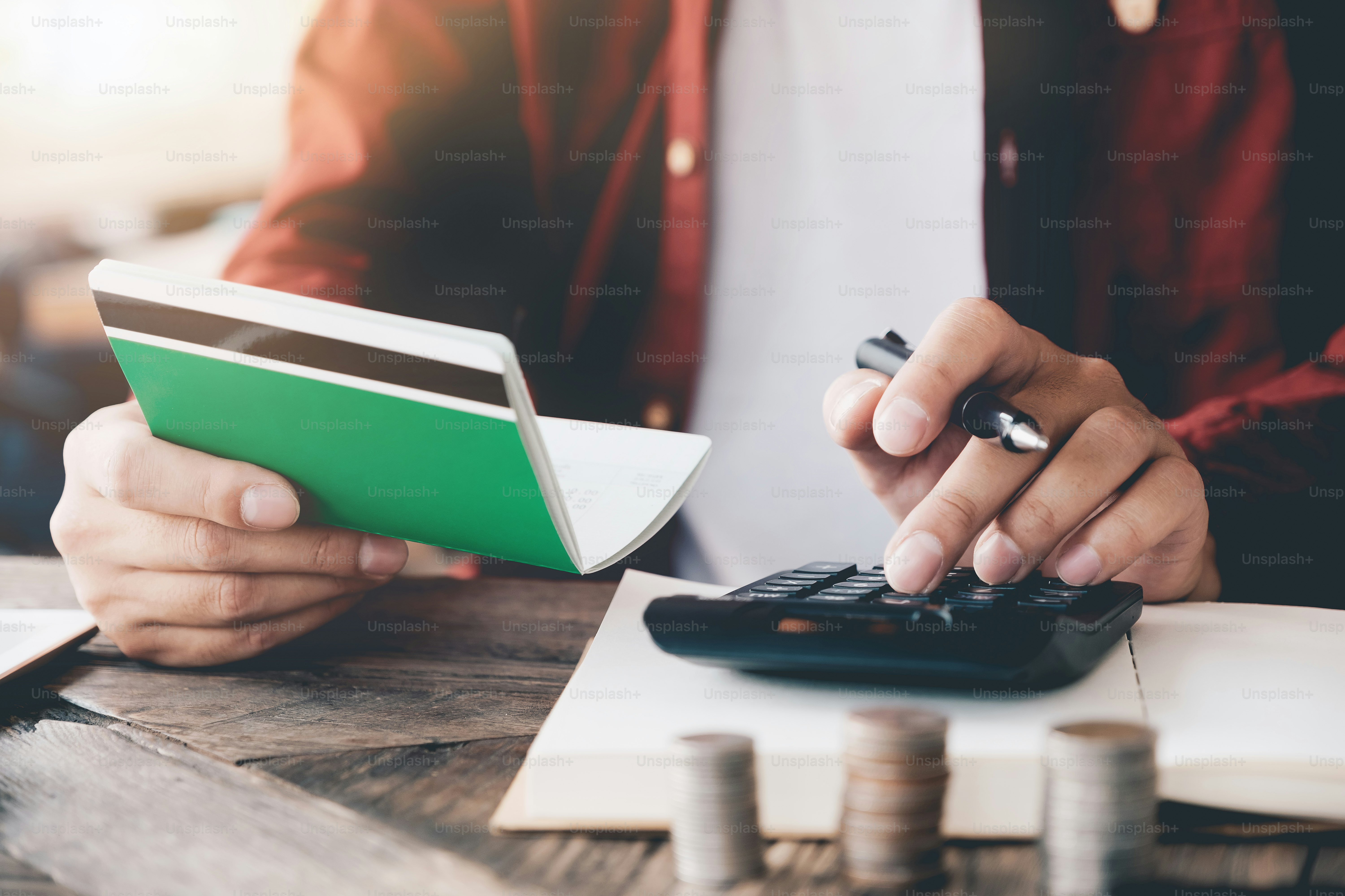Accountant calculating the Saving Account Book and Statement of financial statements at home. Accountancy Concept