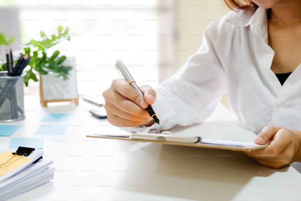 Business woman working at work table,home office desk background, Desk musicians,checklist planning investigate enthusiastic concept.