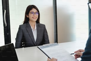 Business situation, job interview concept. Confident young woman in a job interview with corporate personal manager.