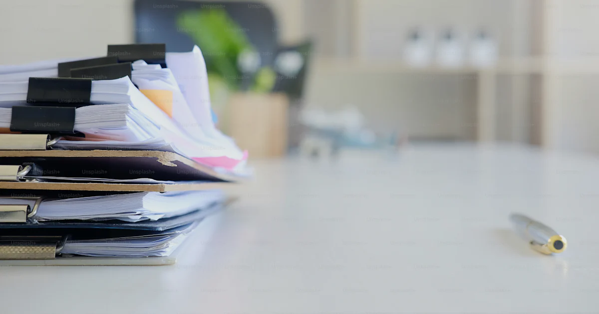 Pc File With Paper In Stack of paper files and pen business equipment on office table. photo ...