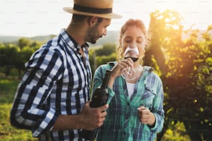 Romantic couple in vineyard before harvesting