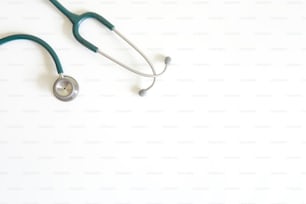 Stethoscope on white desk top and copy space.