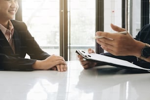 Job interview, Young executives man asking questions to applicant about work history, colloquy dream, Skill, expertise, experience and businesswoman listen to candidate answers.