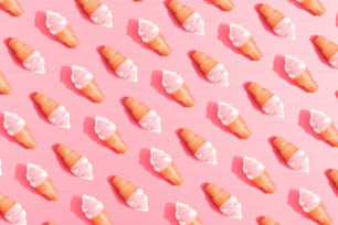 Ice cream pattern on pastel pink background. Creative minimal summer flat lay.